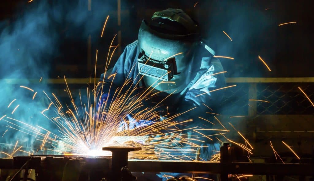 Welder at work, sparks flying